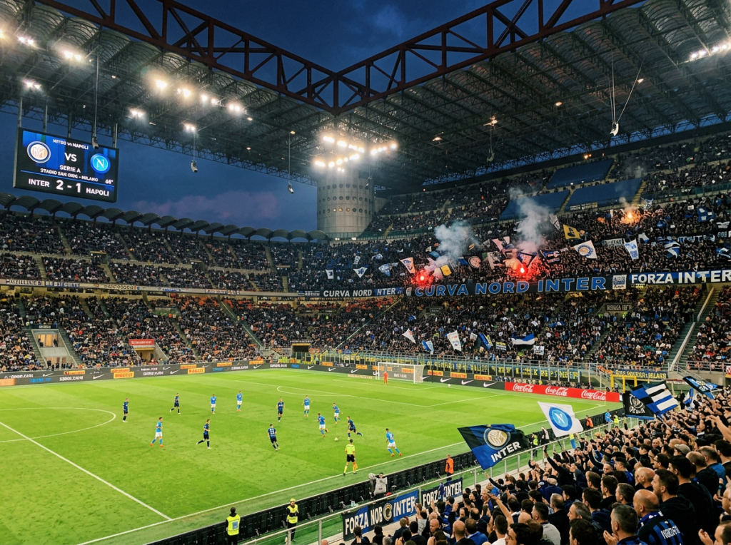Inter and Napoli players compete before a smoke-filled crowd at San Siro